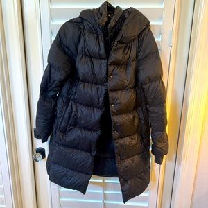Women’s black Athleta down coat with inside down zip vest size small.